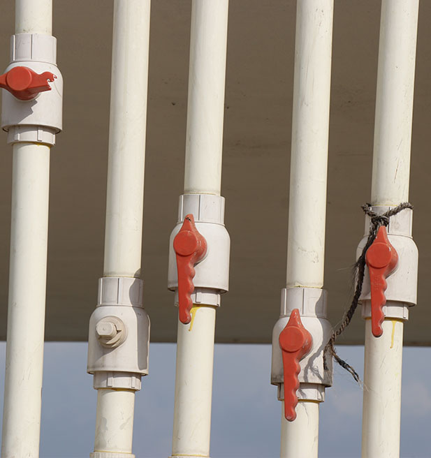 PVC pipes with red plastic valves
